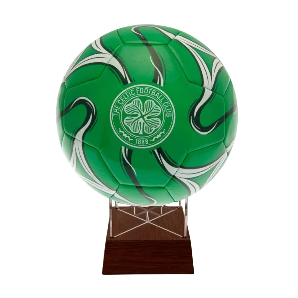 A green Celtic Football Club soccer ball mounted on a clear acrylic display stand with a dark wood base, shown against a plain white background.