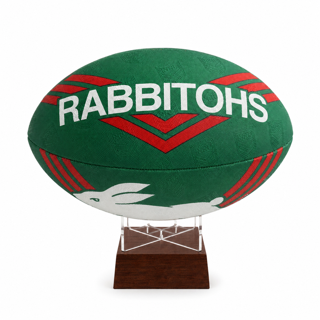A green Rabbitohs rugby ball urn mounted on a clear acrylic stand with a dark wood base, shown against a plain white background.