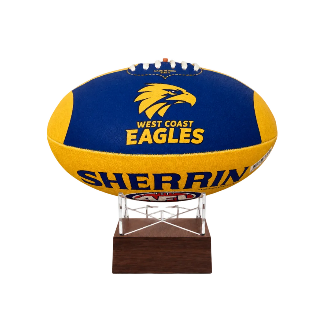 A West Coast Eagles AFL ball urn displayed on a clear acrylic stand with a dark wood base, set against a plain white background.