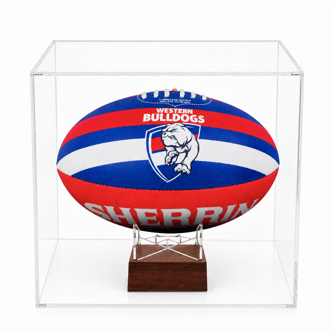 A Western Bulldogs AFL ball displayed inside a clear acrylic cube case on a small wooden stand, photographed against a clean white background.